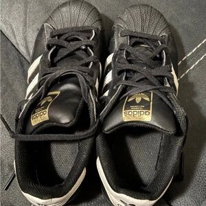 Adidas Kids Black and White Sneakers with Gold Accents